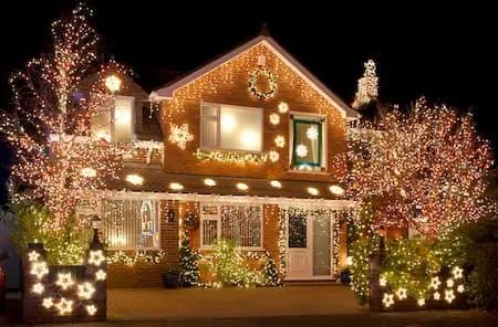 Whole house, trees and yard covered in lights